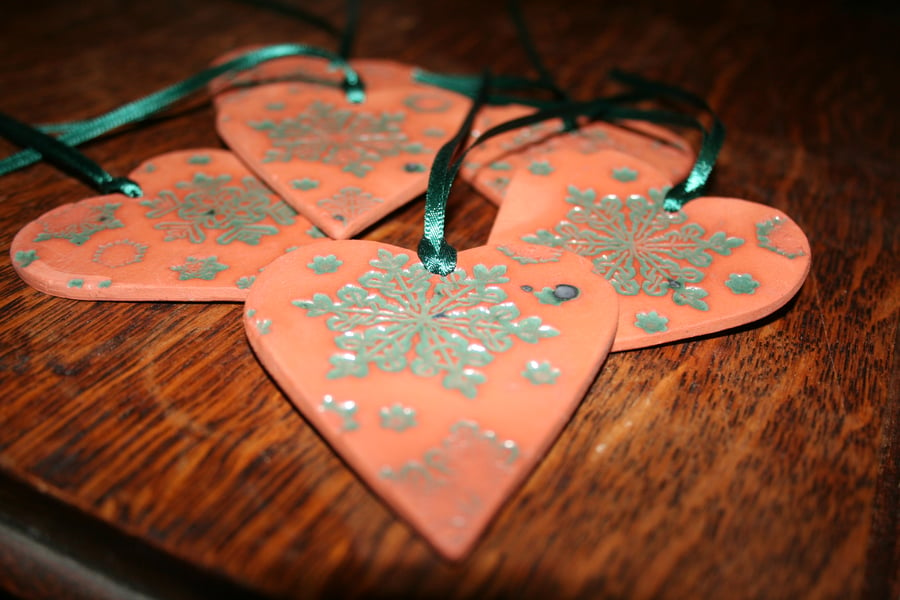 Handmade ceramic green heart embossed with snow flake design decoration
