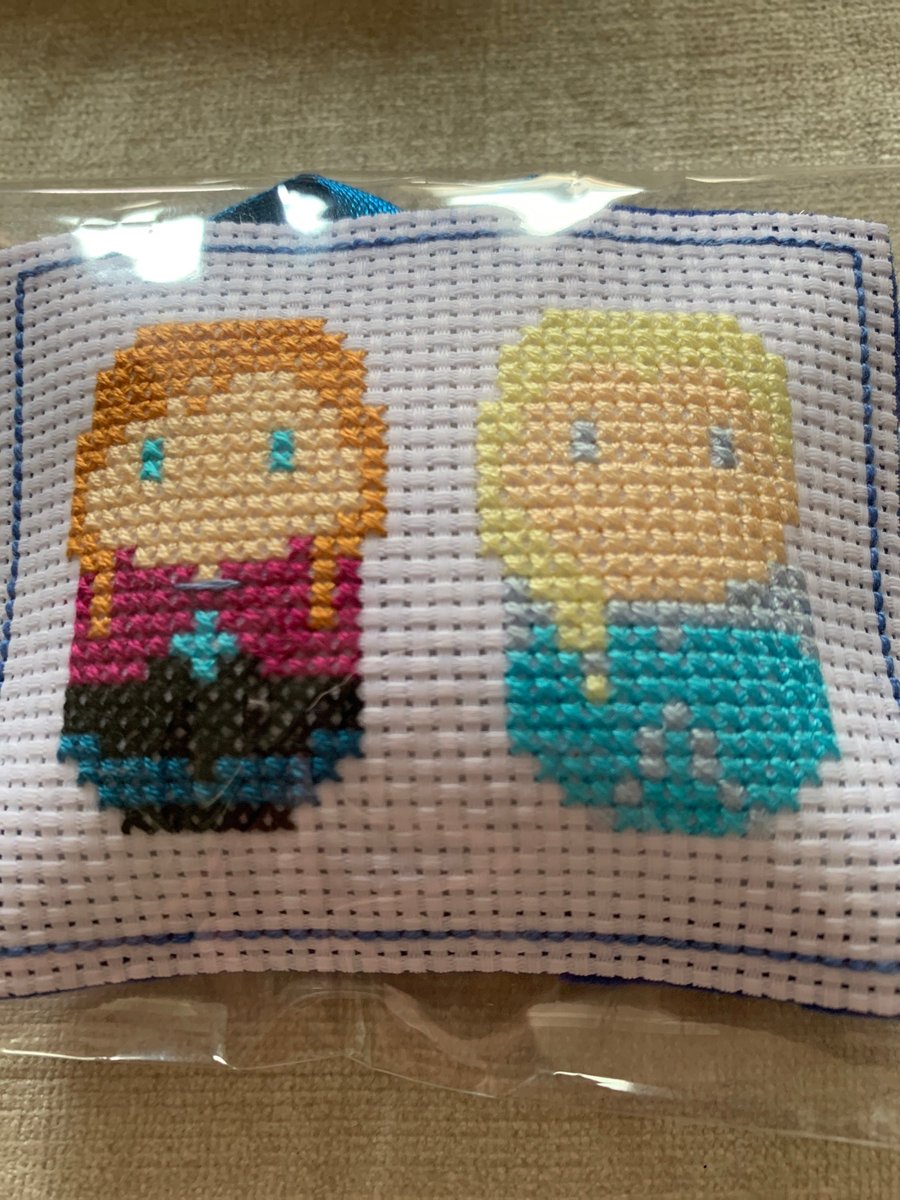 Cross stitched Elsa and Anna hanging decoration. Hanging decoration of frozen .