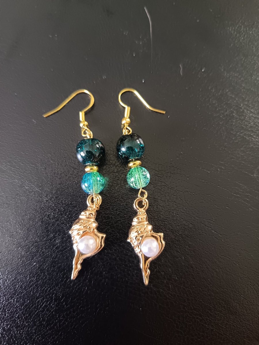 Gold and pearl detail shell charm dangle earrings with blue beads