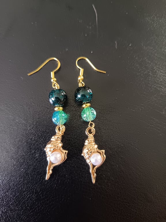 Gold and pearl detail shell charm dangle earrings with blue beads