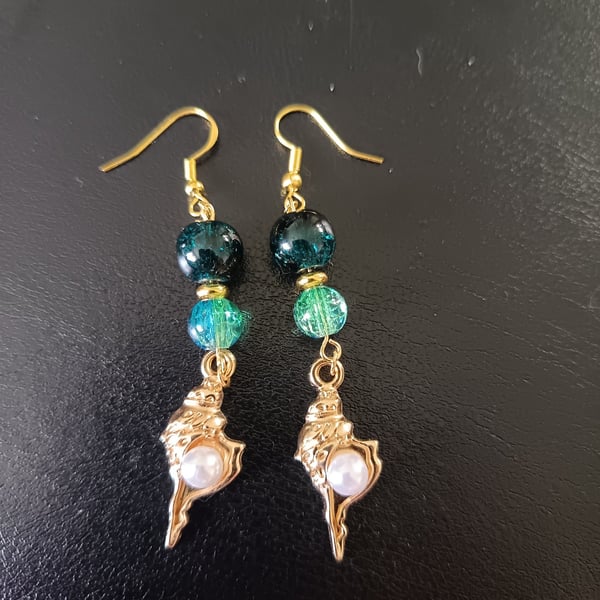 Gold and pearl detail shell charm dangle earrings with blue beads