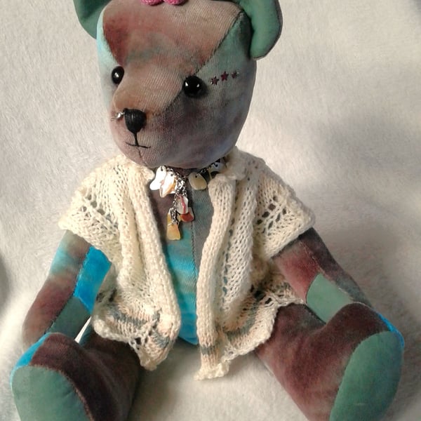 Ocean, a unique collectable velvet bear with a hand knitted lace jacket.