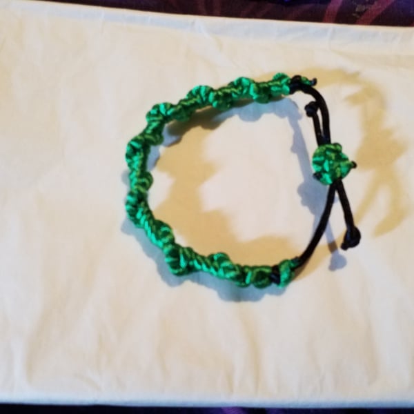 Handmade twisted green macrame adjustable bracelet.