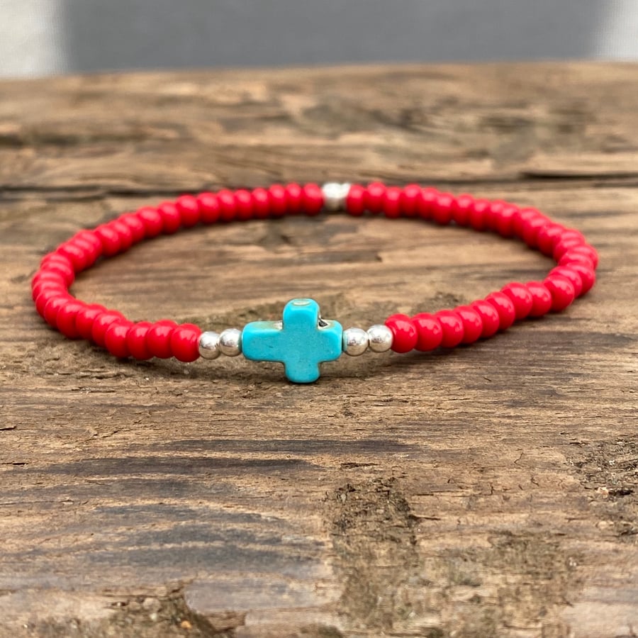 Turquoise howlite cross and red seed bead bracelet 
