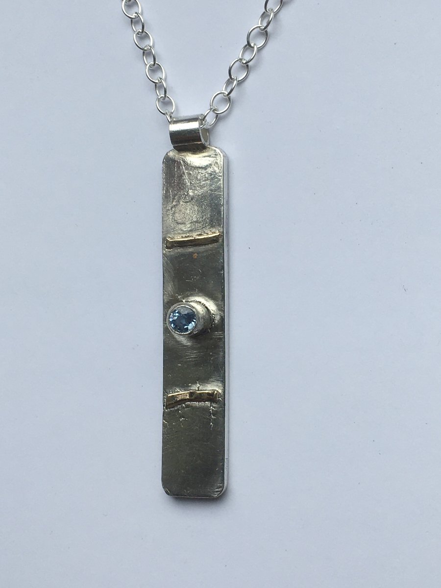 Sapphire grounding pendant 