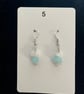 Beautiful dangling earrings with white and turquoise stones.