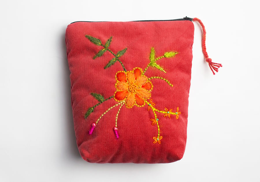Cherokee red make up bag with hand embroidered spiral flower