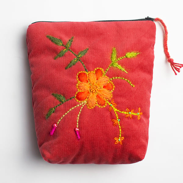 Cherokee red make up bag with hand embroidered spiral flower
