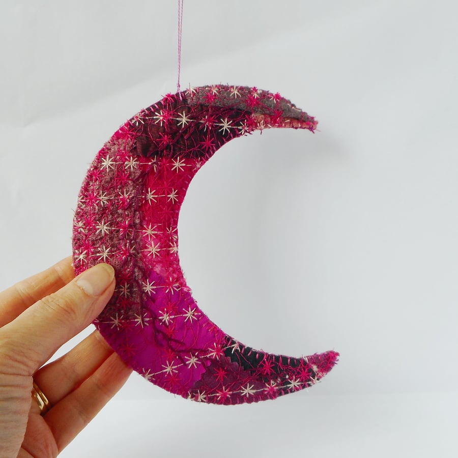 Hanging ornament, embroidered crescent moon in mixed textiles 