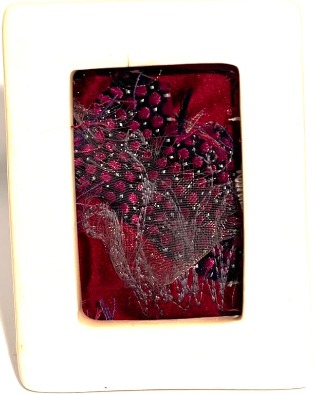 Unique free-motion embroidery art in porcelain frame