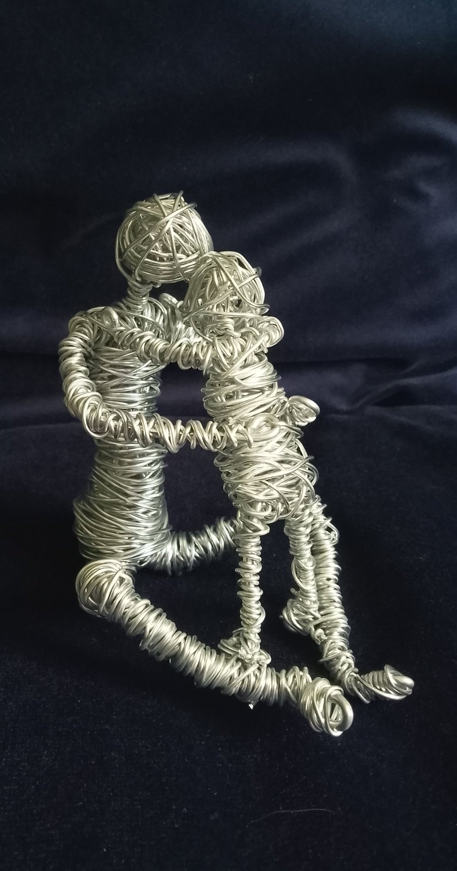 Figures made of wire ..Parent and child