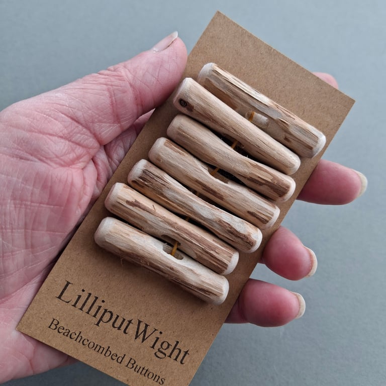 Set of seven driftwood toggle buttons with single hole