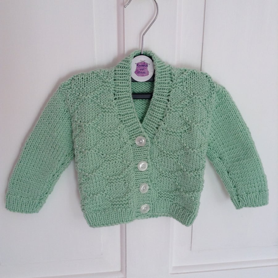 Hand-knitted baby cardigan in mint green