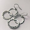 Silver sun design hoop drop earrings