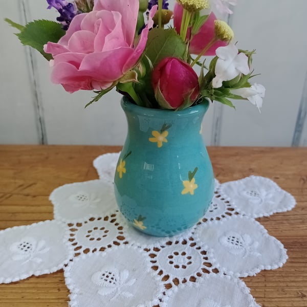 Turquoise posy vase with yellow flower design