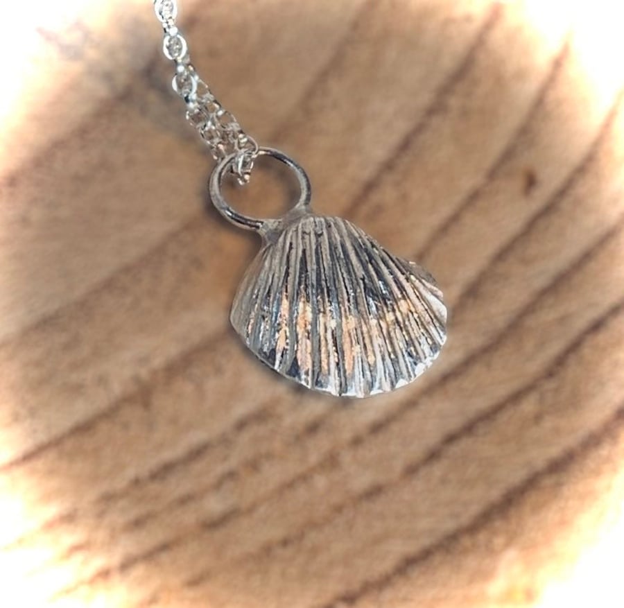 Unique silver cast shell pendant