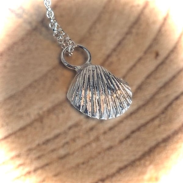 Unique silver cast shell pendant