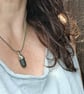 Green sea glass, silver and seed-bead swivel necklace pendant.