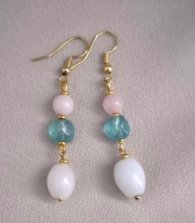 Elegant pale blue faceted stone with pale pink and milky white teardrop beads 