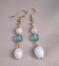 Elegant pale blue faceted stone with pale pink and milky white teardrop beads 