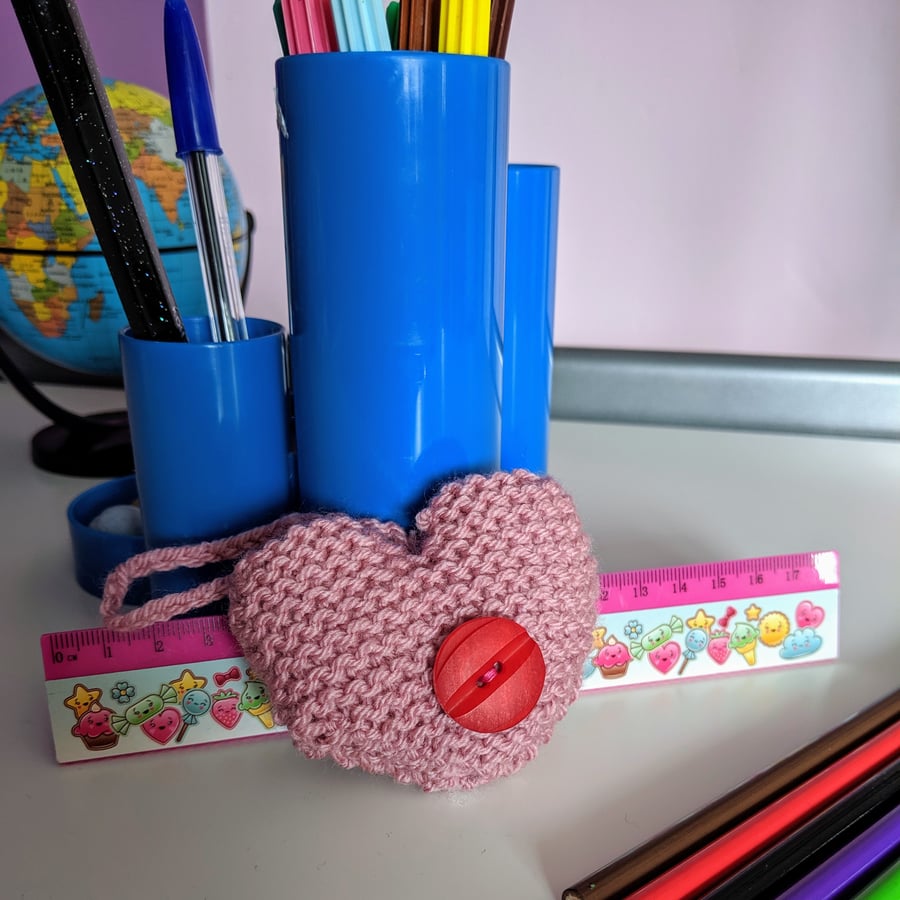 Hand-knitted pink button heart