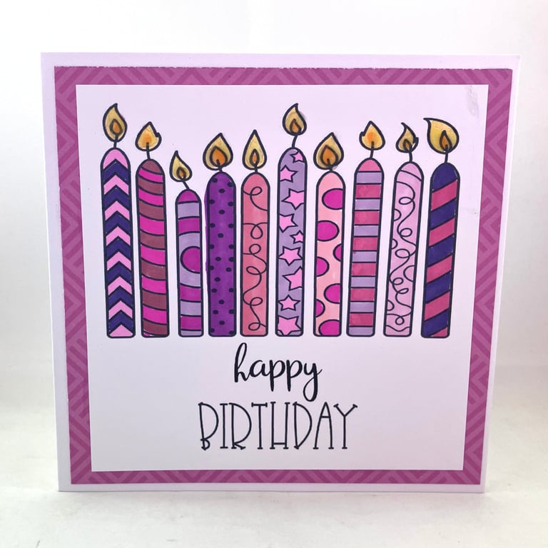 Purple and pink candles birthday card