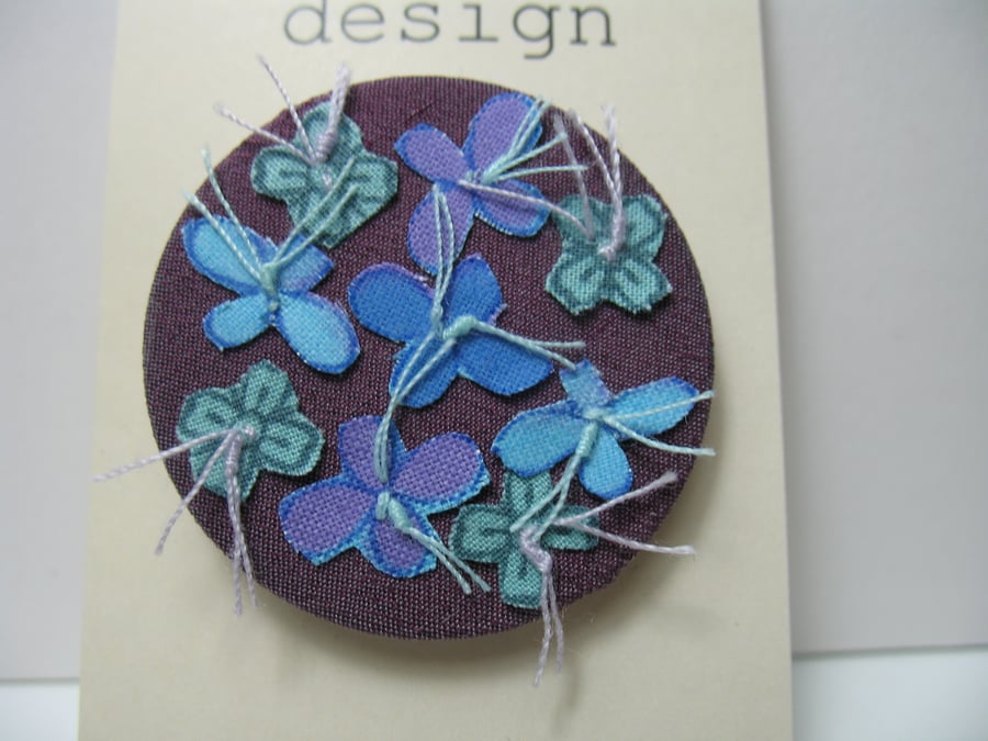 Blue flower brooch