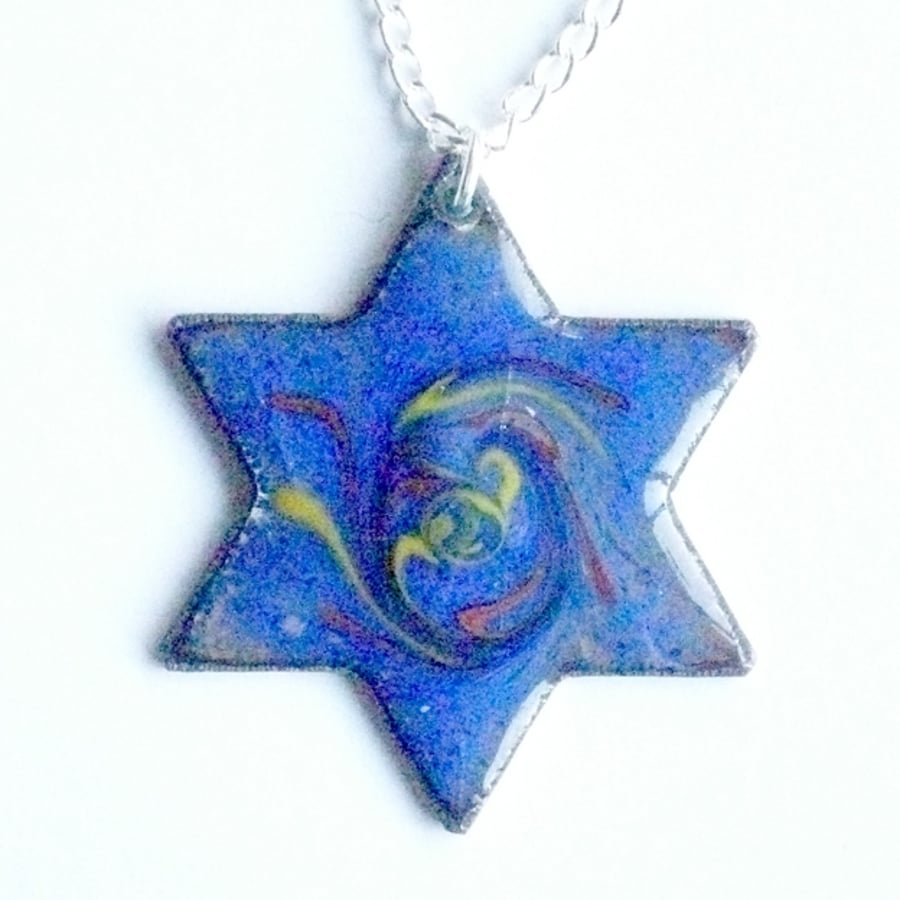 six point star scrolled orange and yellow on blue over clear enamel