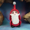 Gnome 'Nicholas' hiding in plain sight Undercover Santa by Ann Galvin