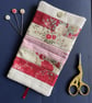 Patchwork stripe needle case made from Tilda fabric in shades of red and natural - Image 2