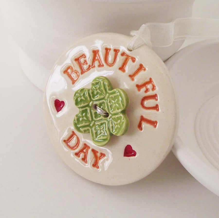 Ceramic Beautiful Day decoration with flower button