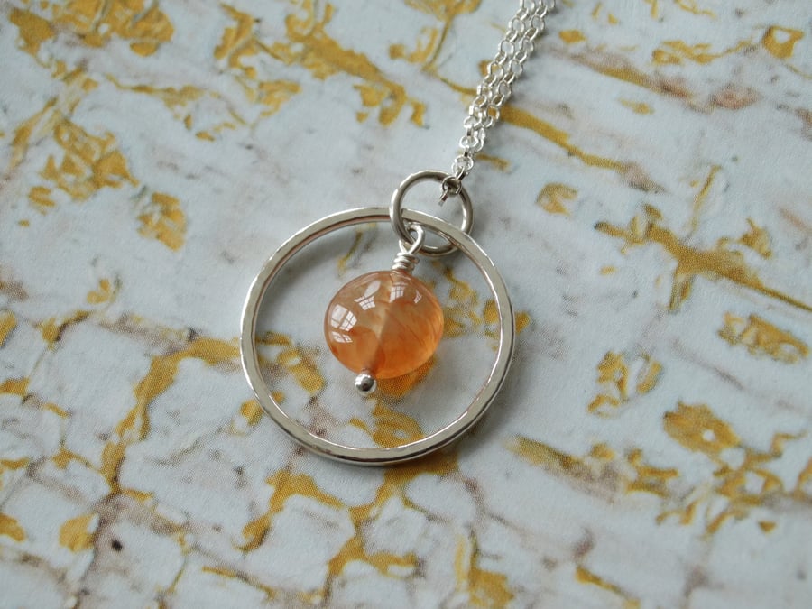 Recycled silver silver lining hoop pendant with autumnal orange carnelian 