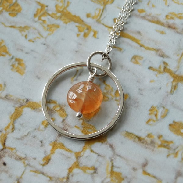 Recycled silver silver lining hoop pendant with autumnal orange carnelian 