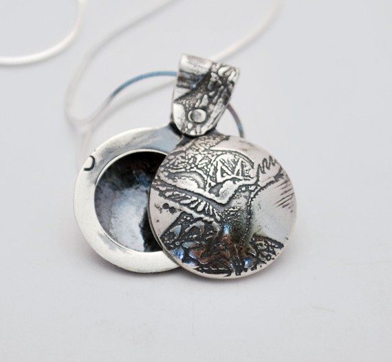 small silver crow swivel locket