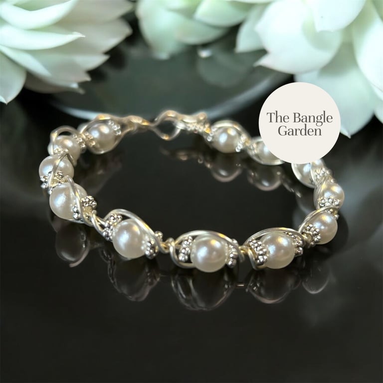 Handmade wire wrapped bangle with faux pearls and shiny spacers