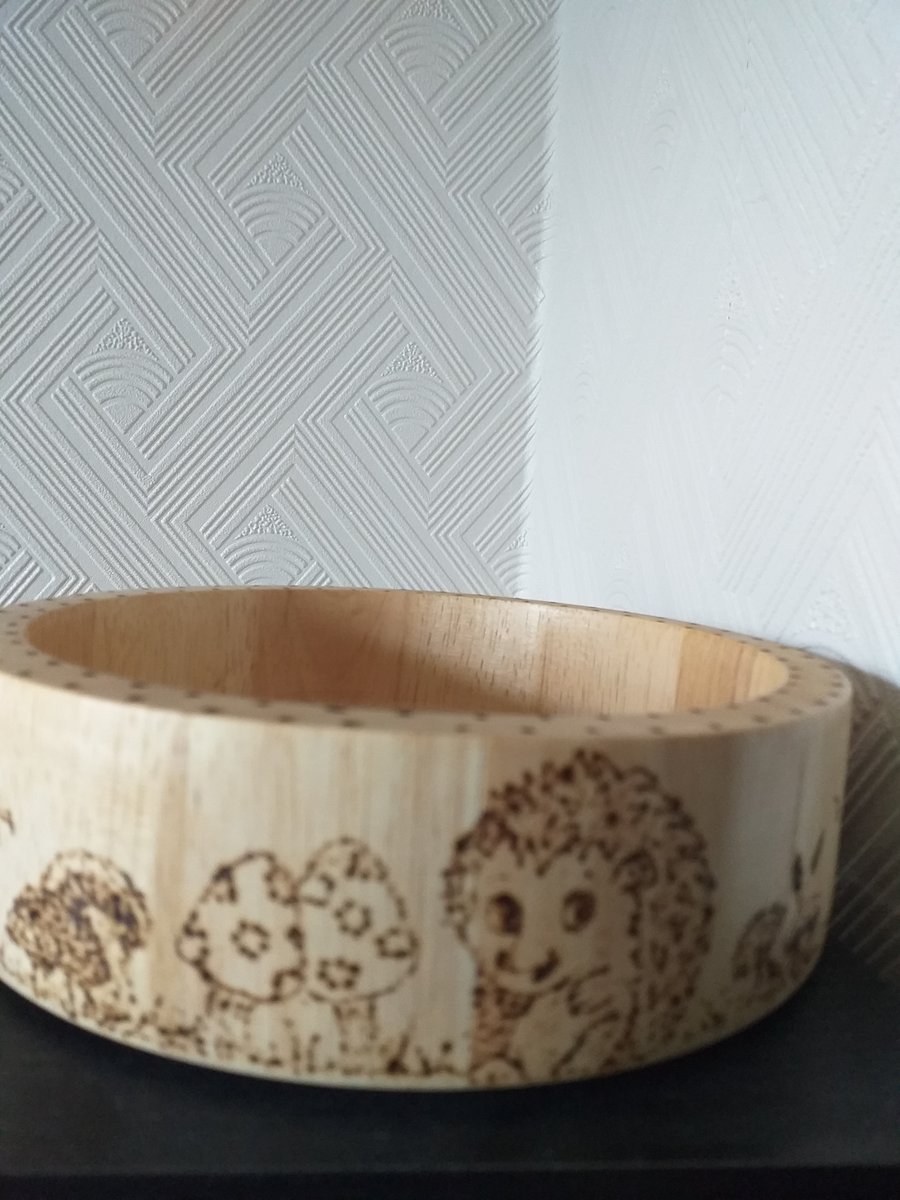 small bowl with cartoon hedgehogs