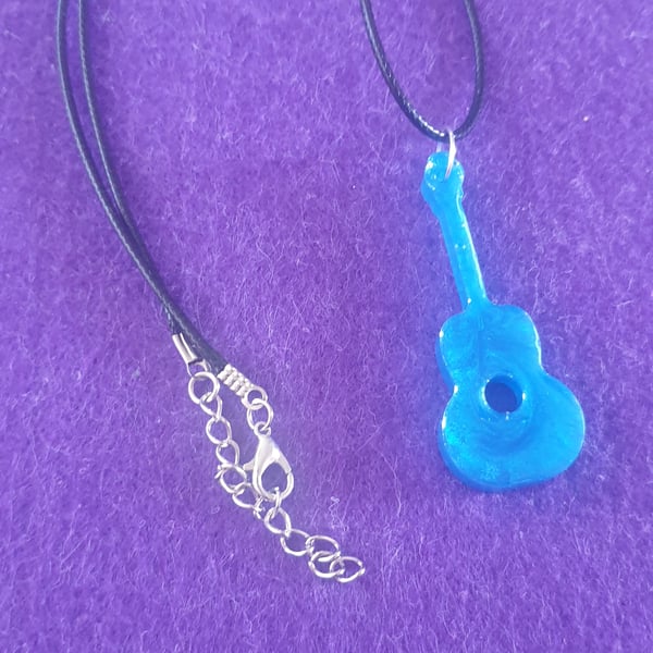 Blue guitar pendant on black cord necklace
