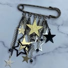 Starry kilt pin brooch with star charms and spinel stones