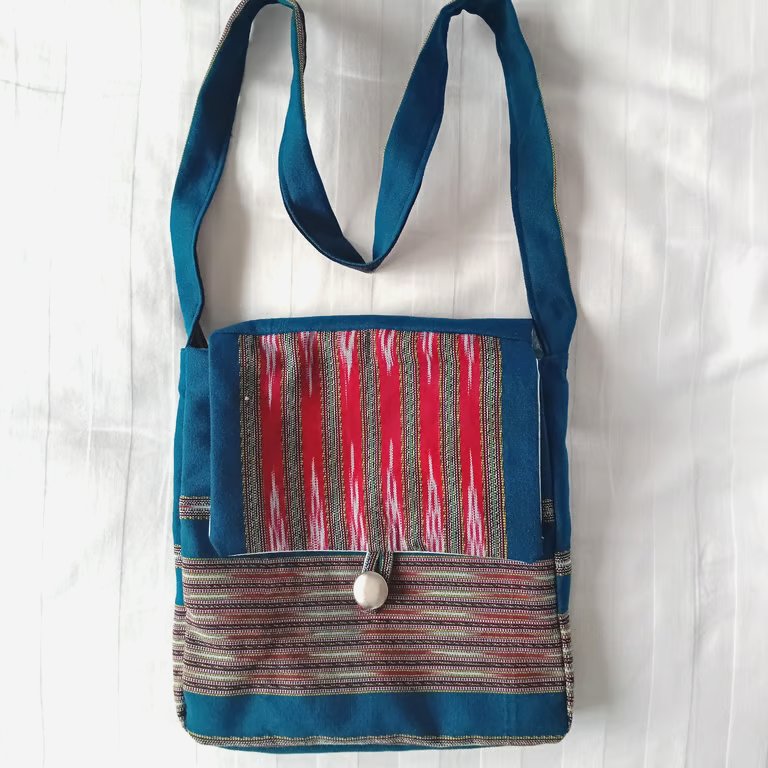 Shoulder bag.  Kingfisher, turquoise, dark red woven fabric