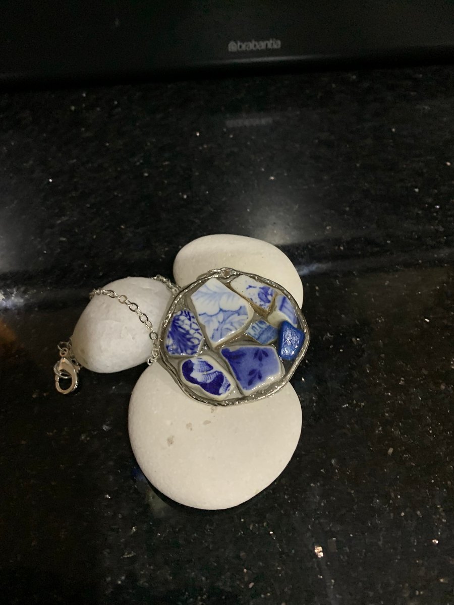 Pottery & resin pendant on silver plate chain