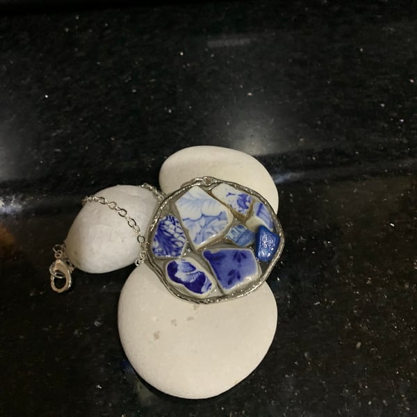 Pottery & resin pendant on silver plate chain