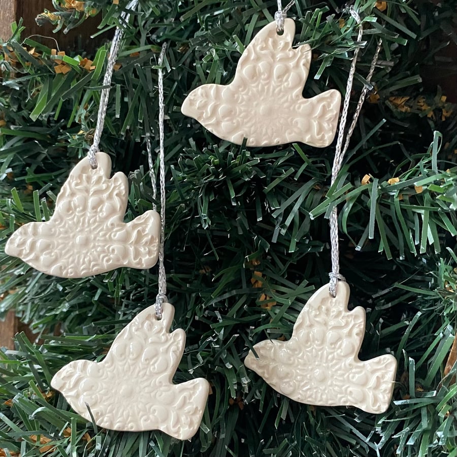 Set of four lightweight ceramic dove decorations