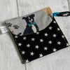 Dog treat bag with small carabiner clip. Black stars.