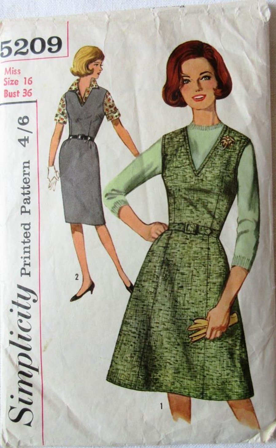 A vintage sewing pattern for a misses' pinafore dress in 2 styles and size 16