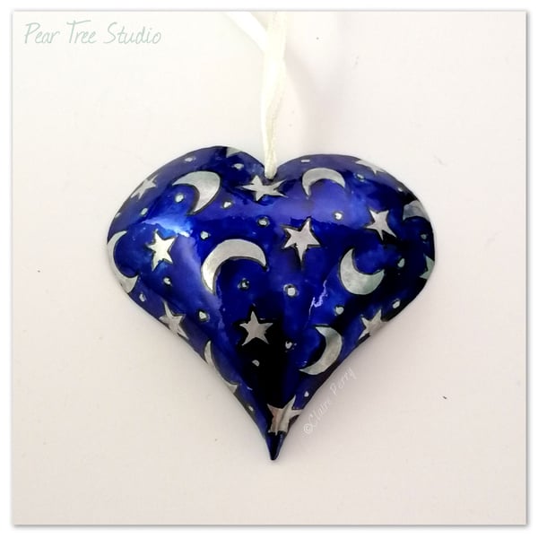 Small blue metal heart decoration with Moons and Stars pattern. Hand made.