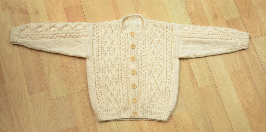 hand knitted cream aran style cardigan to fit 56cm chest age 2 to 3