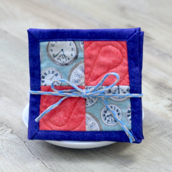 Set of Four Coral and blue quilted drinks coasters featuring vintage clocks