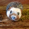 Hedgehog hand painted on rock 