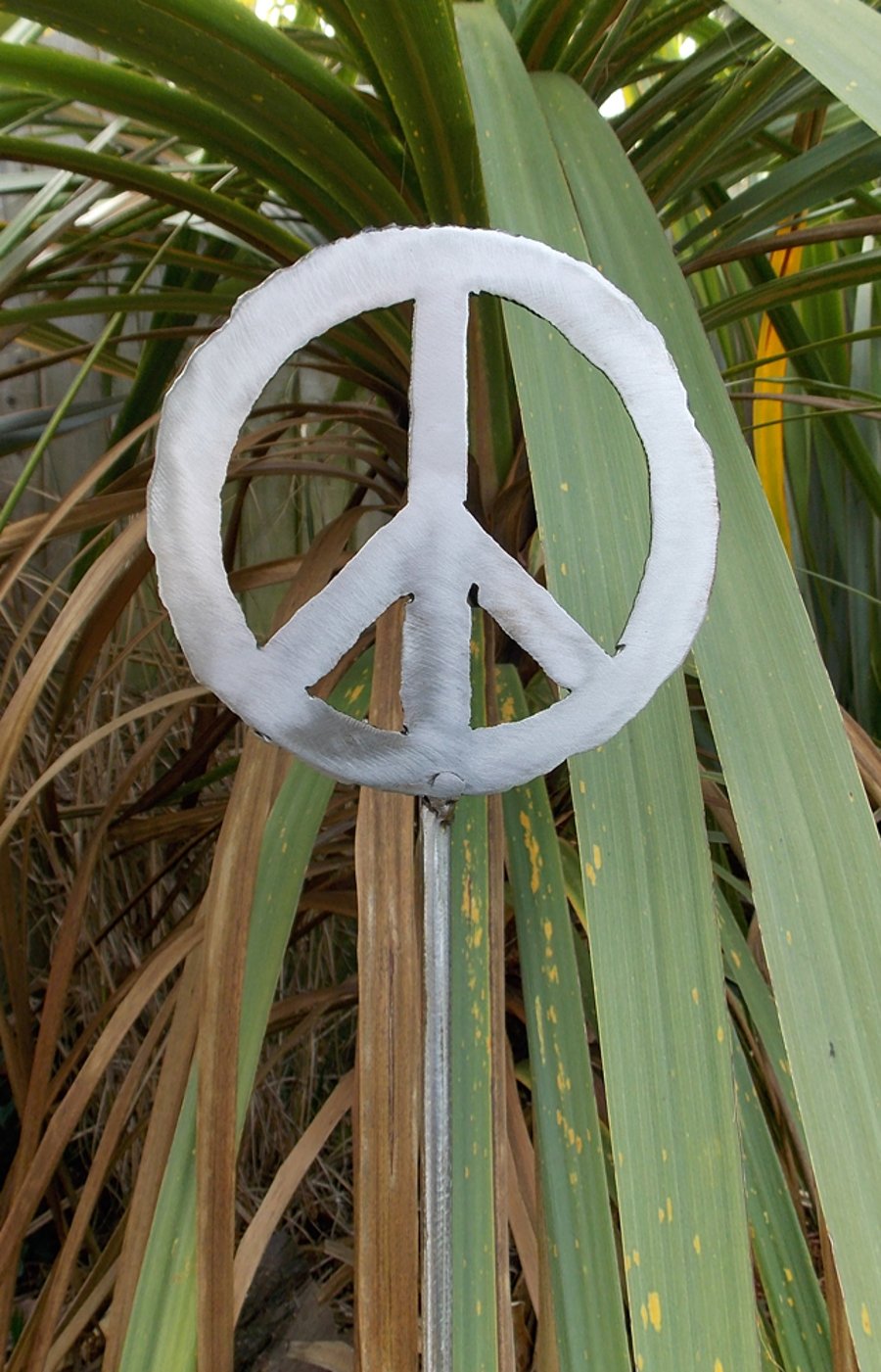  'peace'  polished metal plant support, 110cm approx.