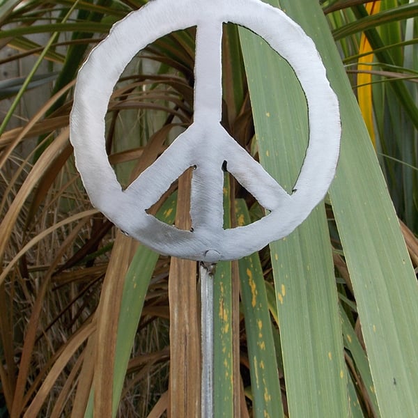  'peace'  polished metal plant support, 110cm approx.